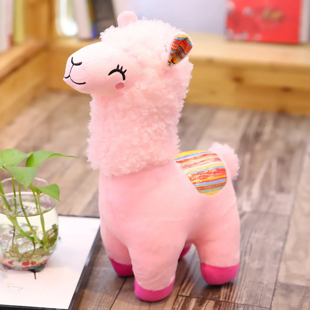 Alpaca llama plush toy in white standing on a surface
