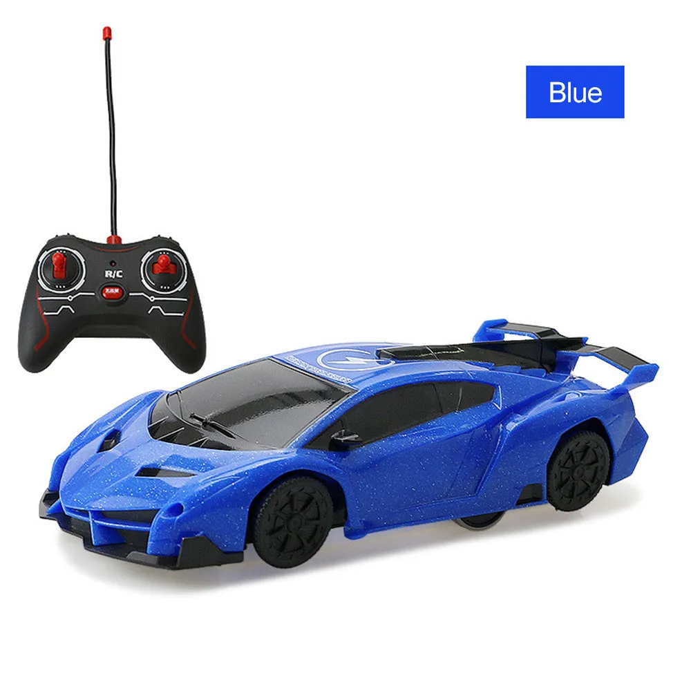 Remote control wall climbing car in red with industrial fan vents and white adsorbent strip on bottom, 1/28 scale