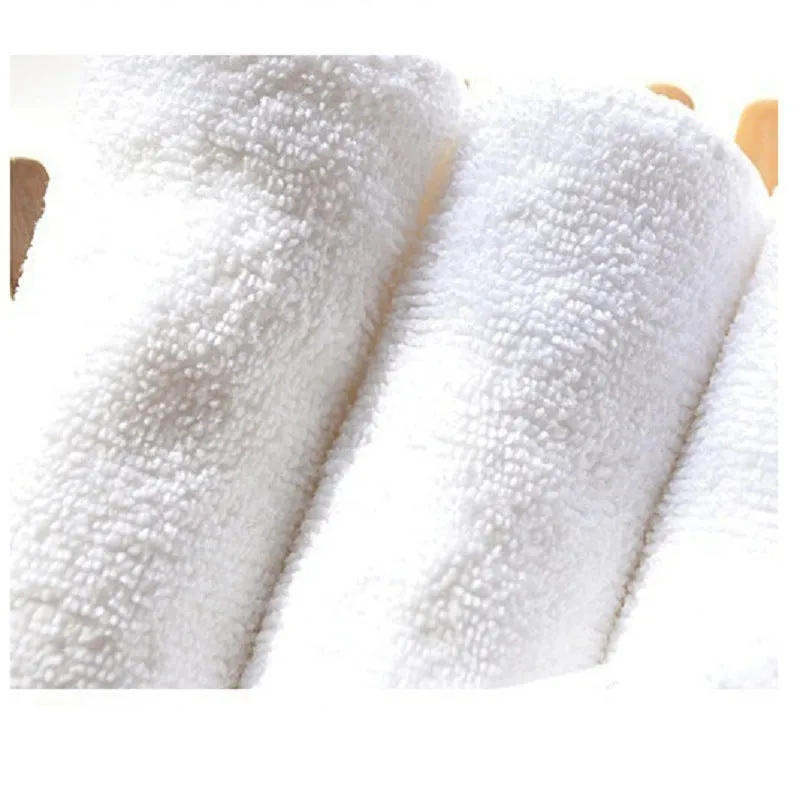 White microfiber washable diaper absorbent pad 33x13cm on plain background