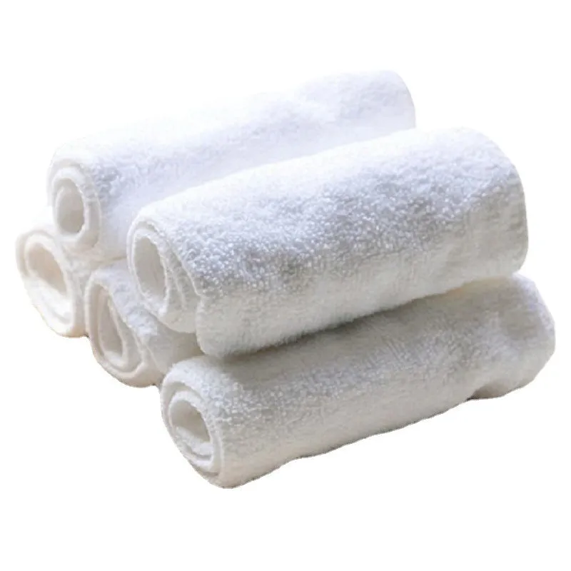 White microfiber washable diaper absorbent pad 33x13cm on plain background