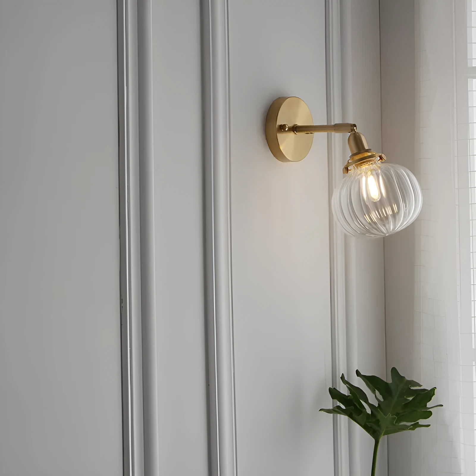 Pumpkin-shaped glass wall lamp in blue and transparent water ripple glass finishes.