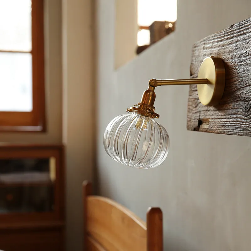 Pumpkin-shaped glass wall lamp in blue and transparent water ripple glass finishes.