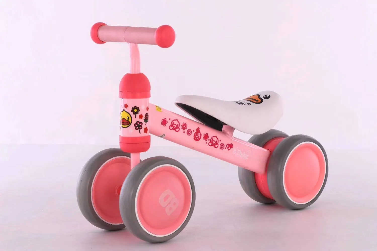 Plastic no-pedal baby balance bike with three wheels, carbon steel frame, EVA foam tyres, and artificial PU leather seat