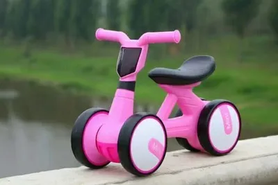 Plastic no-pedal baby balance bike with three wheels, carbon steel frame, EVA foam tyres, and artificial PU leather seat