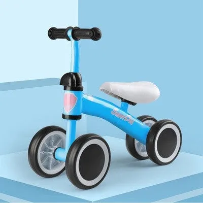 Plastic no-pedal baby balance bike with three wheels, carbon steel frame, EVA foam tyres, and artificial PU leather seat