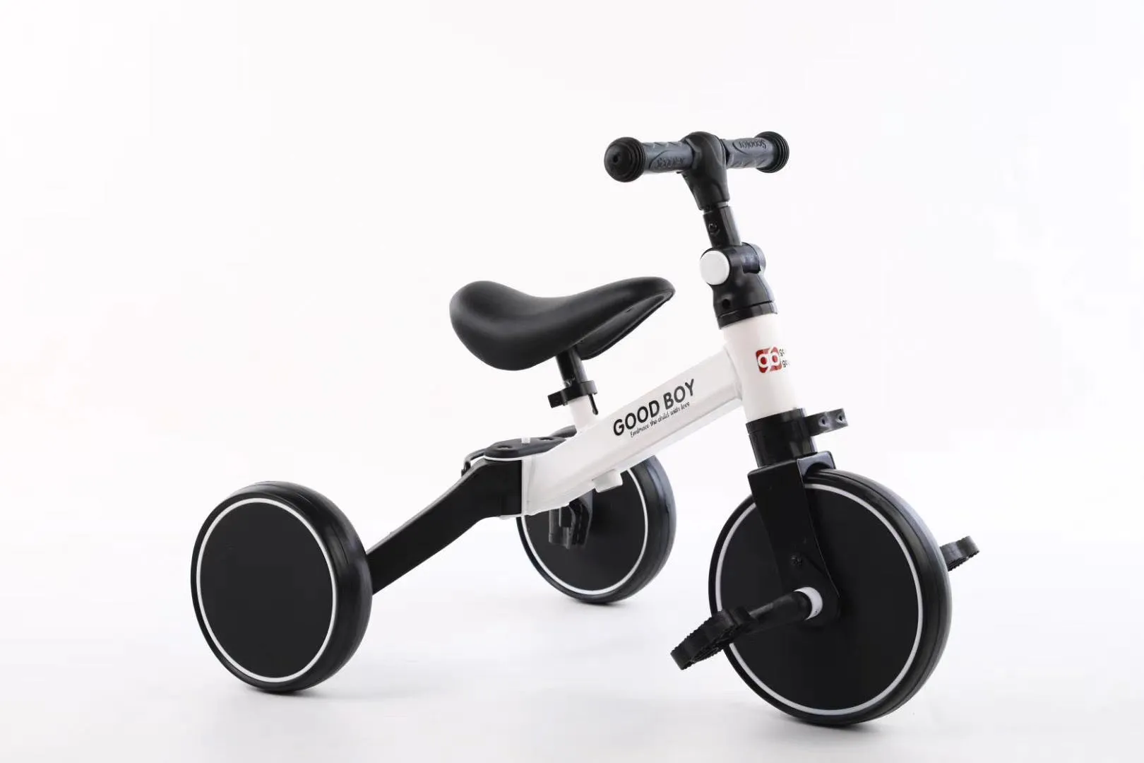 Plastic no-pedal baby balance bike with three wheels, carbon steel frame, EVA foam tyres, and artificial PU leather seat
