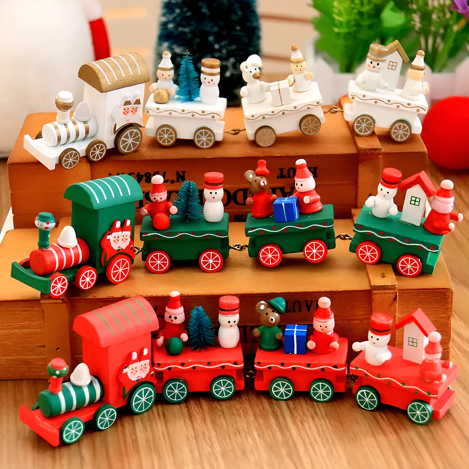 Set of four mini wood train toys in red white and green with painted passengers for shelf display