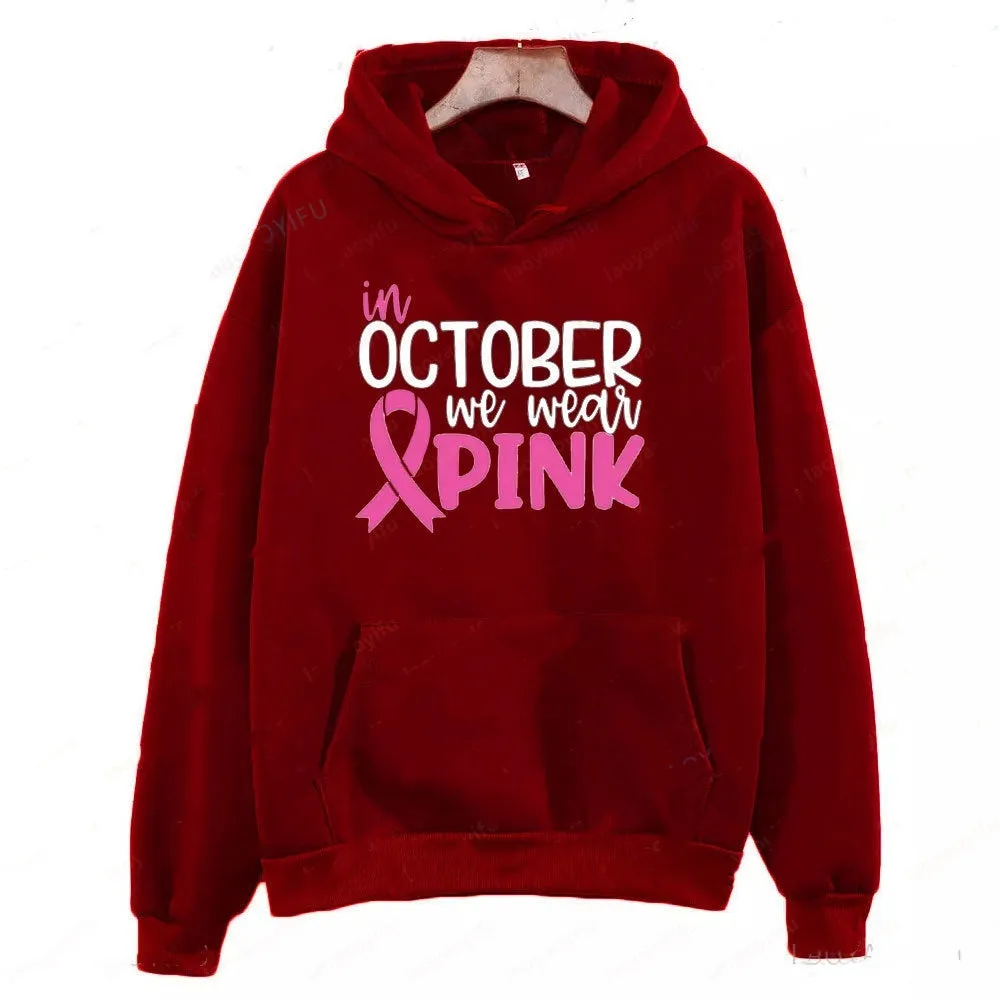 Women's pink sweatshirt with 'I'm A Survivor' retro graphic print and a side seam pocket.