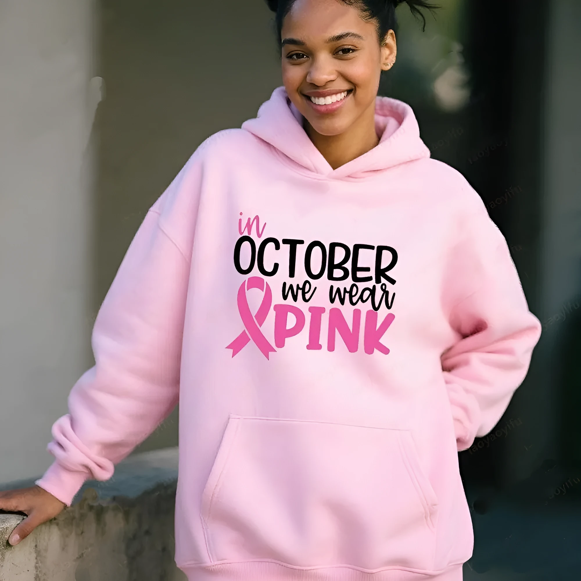 Women's pink sweatshirt with 'I'm A Survivor' retro graphic print and a side seam pocket.