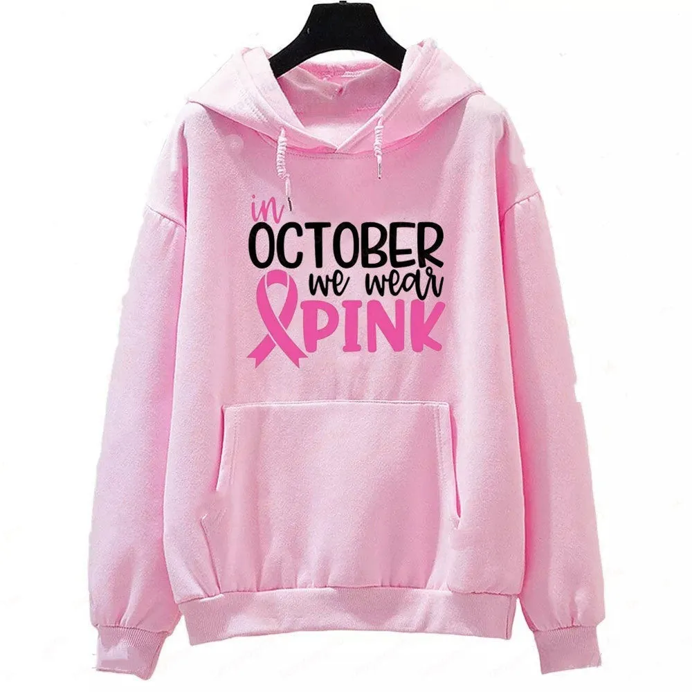 Women's pink sweatshirt with 'I'm A Survivor' retro graphic print and a side seam pocket.