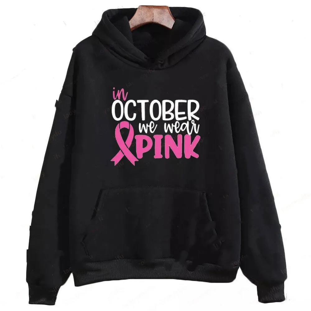 Women's pink sweatshirt with 'I'm A Survivor' retro graphic print and a side seam pocket.