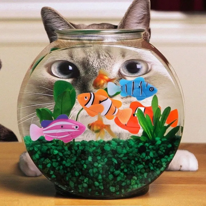 Set of four swimming electronic pet fish toys in red, orange, pink, and blue on a white background