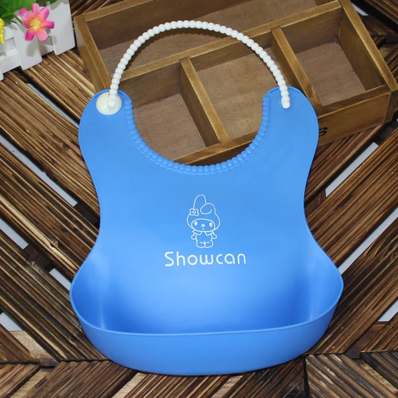 Baby soft silicone bib in pink with cartoon pattern, adjustable closure, 27x21cm