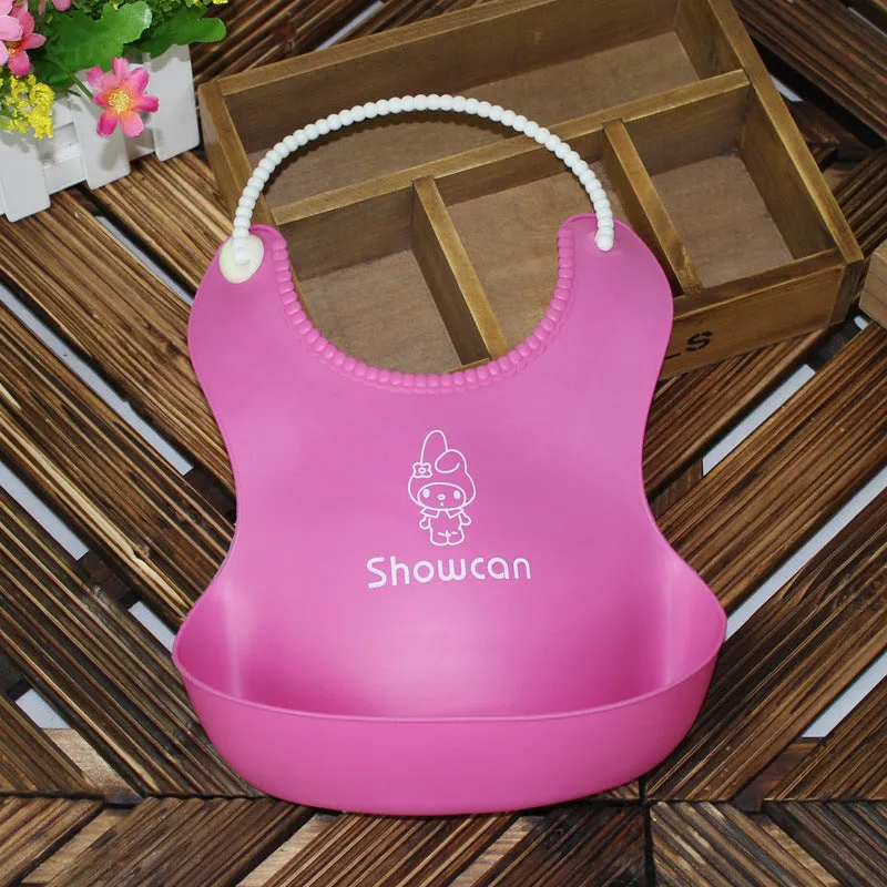 Baby soft silicone bib in pink with cartoon pattern, adjustable closure, 27x21cm