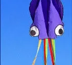 Large 4-metre octopus soft kite in red with 30-metre line and control handle on beach