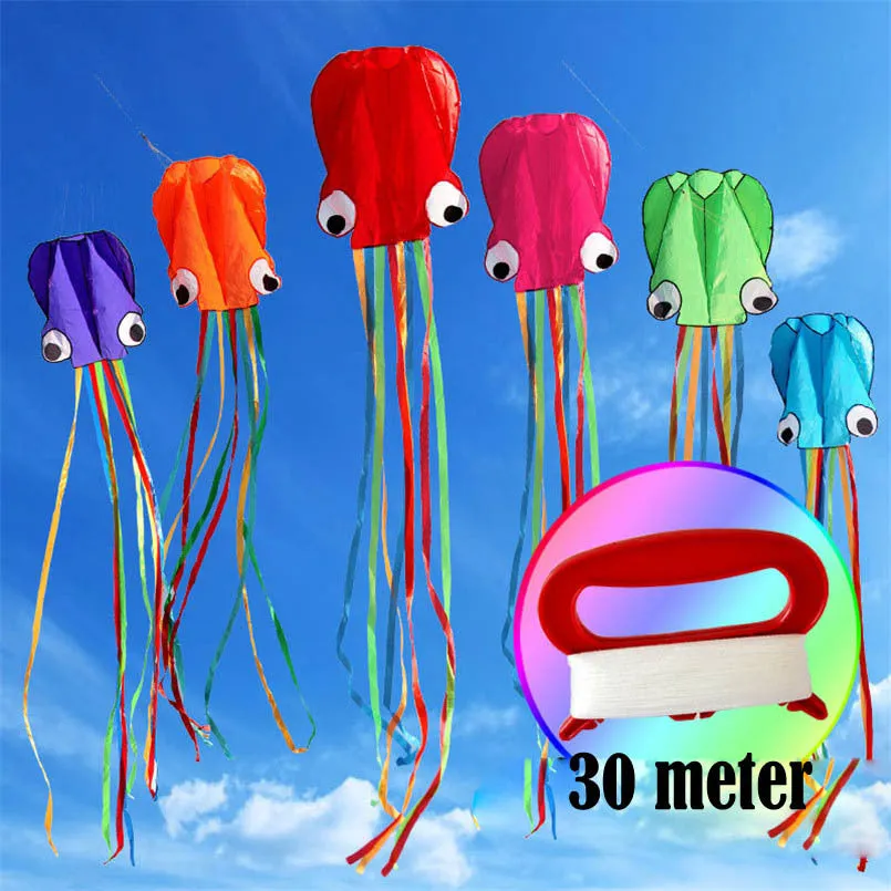 Large 4-metre octopus soft kite in red with 30-metre line and control handle on beach