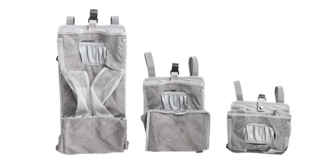 Grey attachable storage bag with diamond mesh panel and PP support plate, 44.6x23x16cm, hung on a white baby cot
