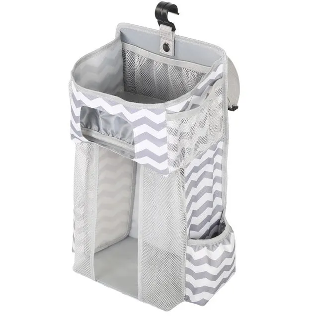 Grey attachable storage bag with diamond mesh panel and PP support plate, 44.6x23x16cm, hung on a white baby cot