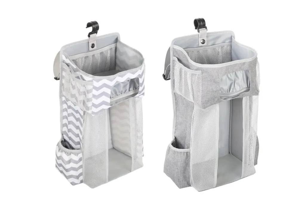 Grey attachable storage bag with diamond mesh panel and PP support plate, 44.6x23x16cm, hung on a white baby cot