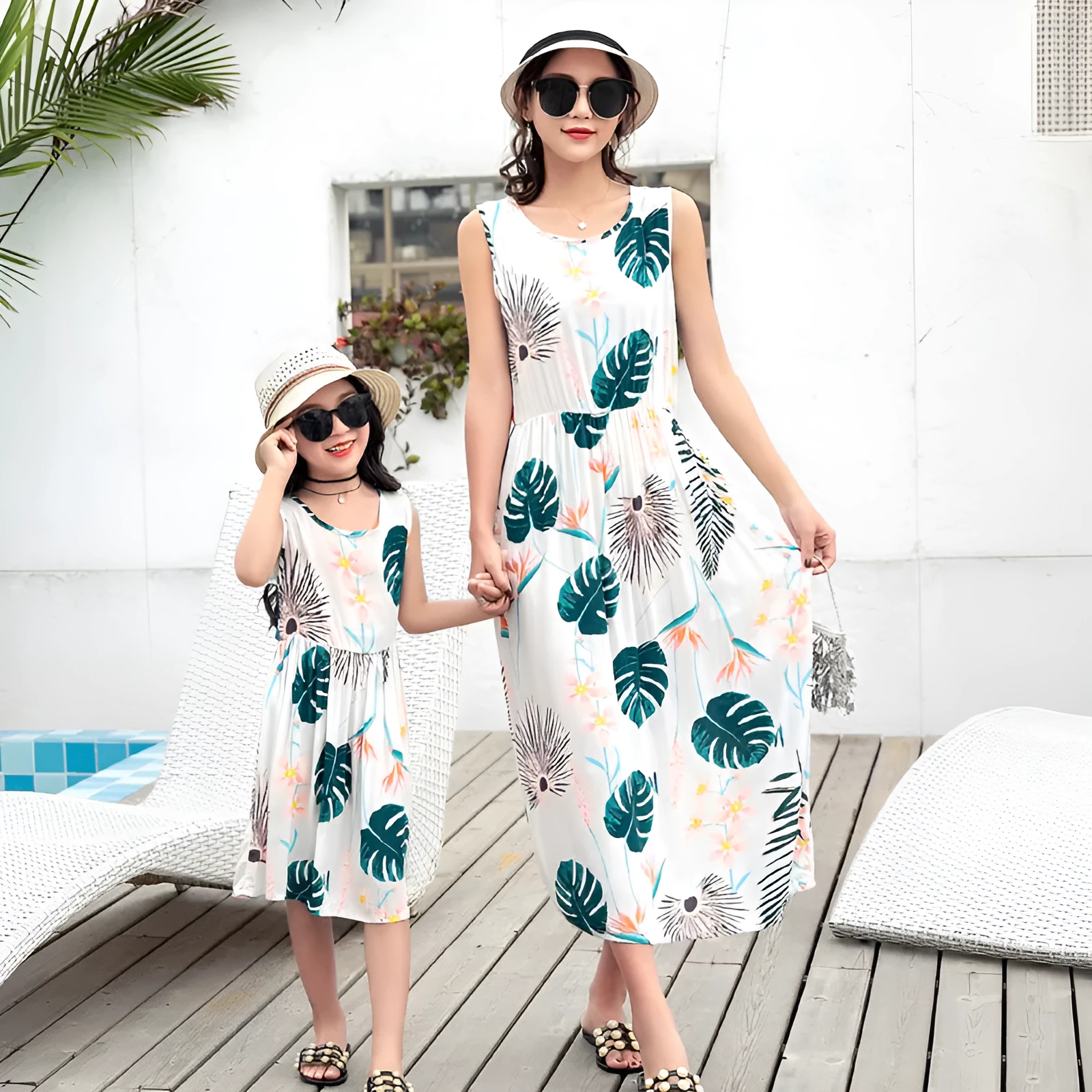 Mother and daughter wearing matching JWH vest and long skirt set in banana leaf print for beach vacation