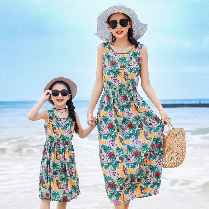 Mother and daughter wearing matching JWH vest and long skirt set in banana leaf print for beach vacation