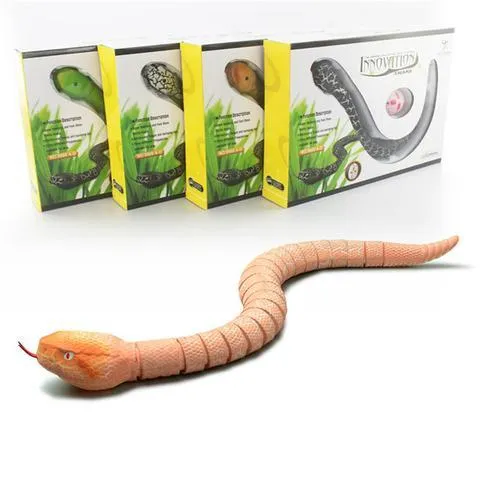 Novelty Remote Control Snake in green colour, 38 cm plastic toy with retractable tongue on a wooden floor