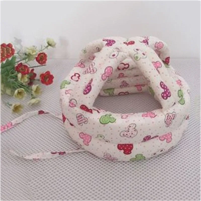 Baby anti collision hat with high-density sponge padding, adjustable headband, breathable cotton outer, colourful design