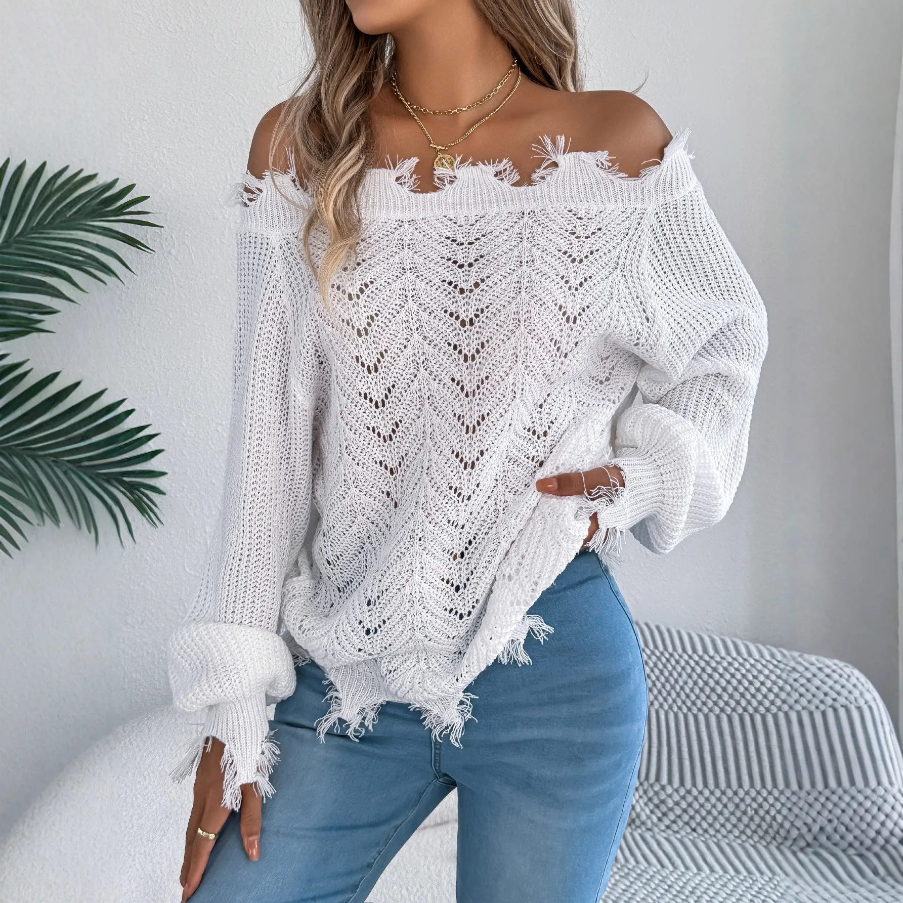 Hollow-out long-sleeved off-the-shoulder pullover sweater in artificial wool acrylic fibre available in black, orange, and white colours