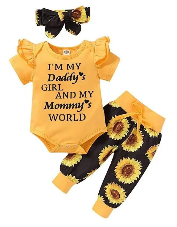 Baby jumpsuit set with cotton top, pants, and matching headband in black letter print