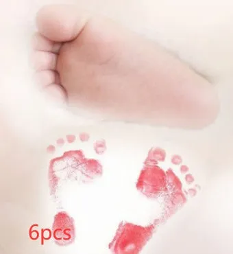Baby hand and footprint ink pad set with non-toxic washable ink in black red and blue colours on white background