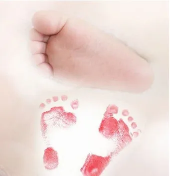 Baby hand and footprint ink pad set with non-toxic washable ink in black red and blue colours on white background