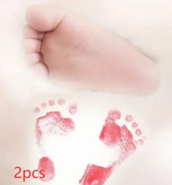 Baby hand and footprint ink pad set with non-toxic washable ink in black red and blue colours on white background