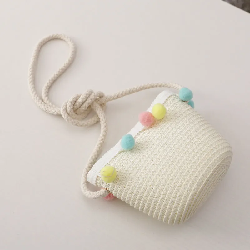 Children's straw hat and bag set in solid colour, large brim, dome top with cartoon pattern and hairy ball detail