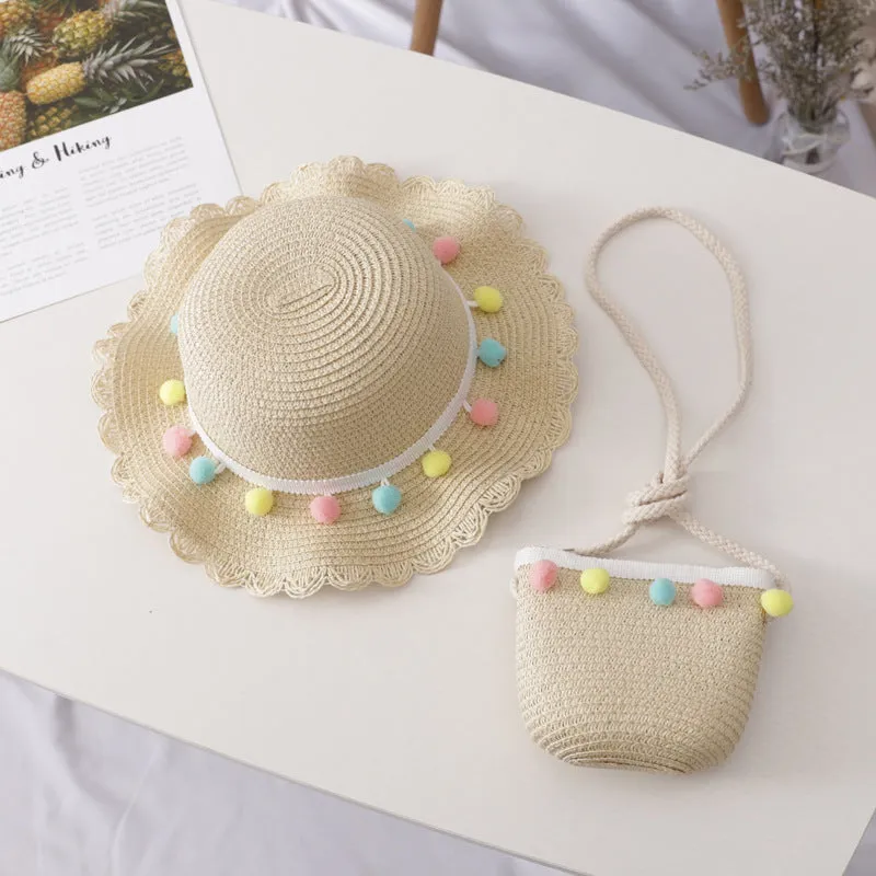 Children's straw hat and bag set in solid colour, large brim, dome top with cartoon pattern and hairy ball detail