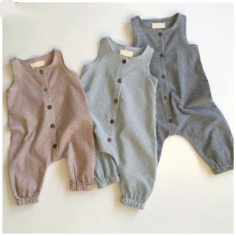 Black baby romper with lid buckle closure and sleeveless cotton design for newborns