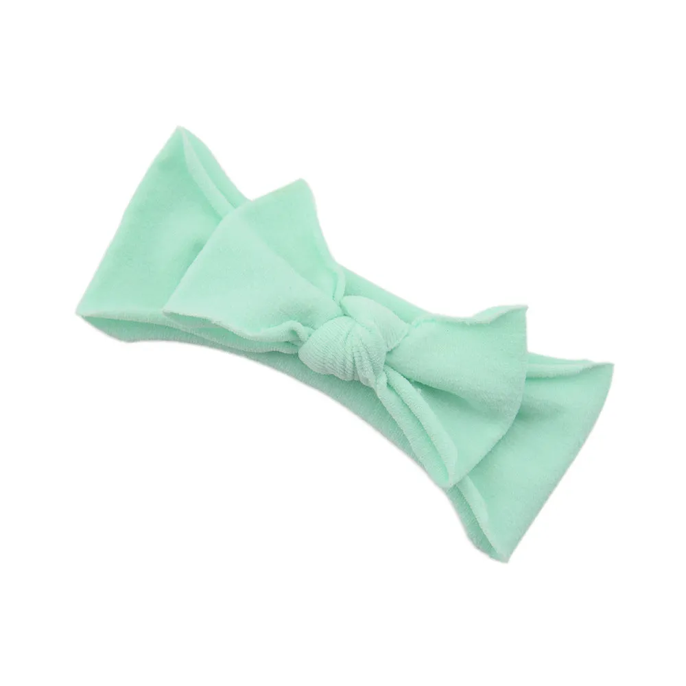 Solid colour knotted cloth headband for baby girls with bowknot design, available in 37 colours