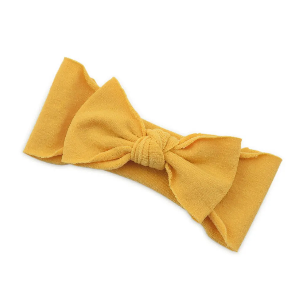 Solid colour knotted cloth headband for baby girls with bowknot design, available in 37 colours
