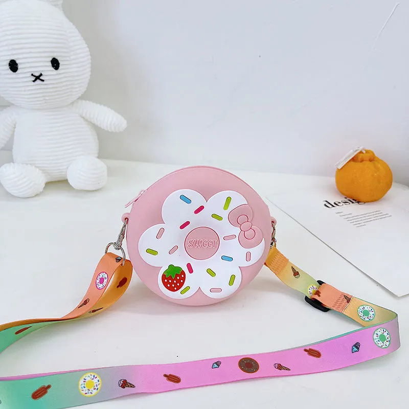 Silicone children's coin purse in round yellow with cartoon donut pattern and crossbody strap
