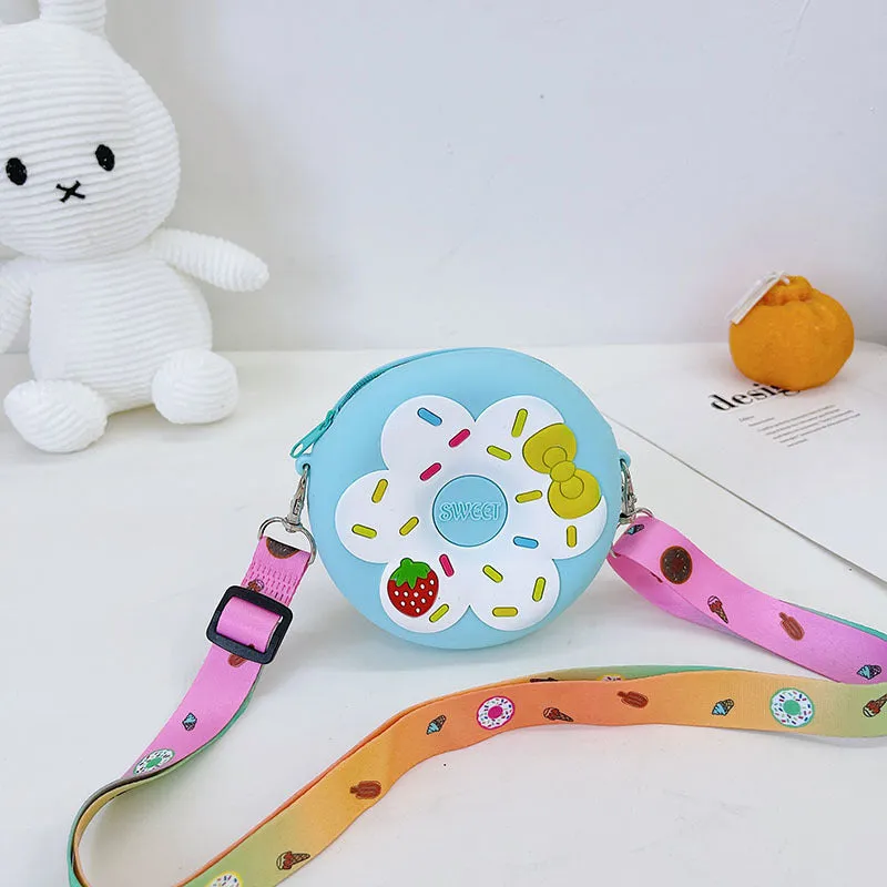 Silicone children's coin purse in round yellow with cartoon donut pattern and crossbody strap