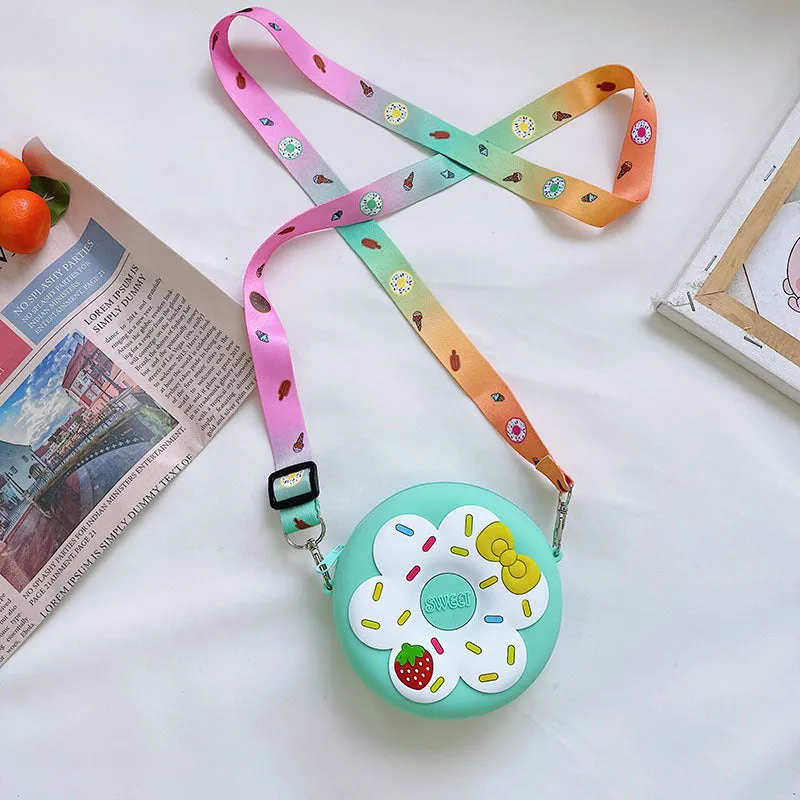 Silicone children's coin purse in round yellow with cartoon donut pattern and crossbody strap