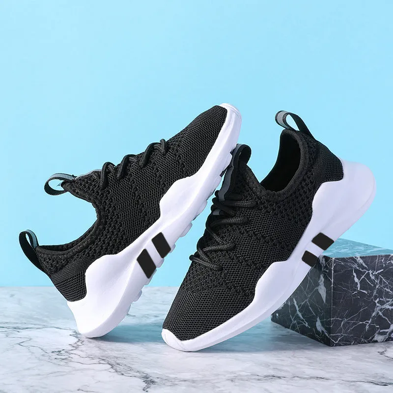 Breathable fly woven children's sports shoe in black with mesh upper and MD sole, side view