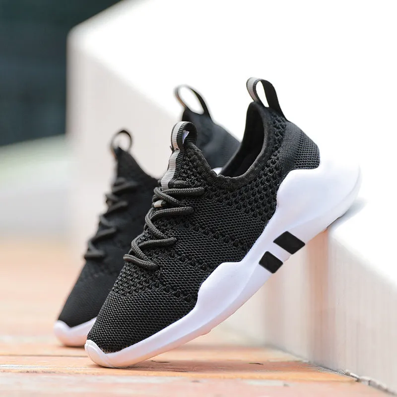Breathable fly woven children's sports shoe in black with mesh upper and MD sole, side view