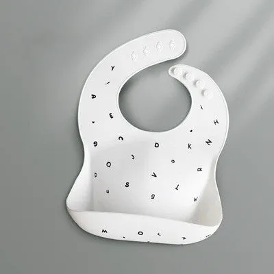 Pink baby waterproof silicone feeding bib with deep pocket and white daisy pattern