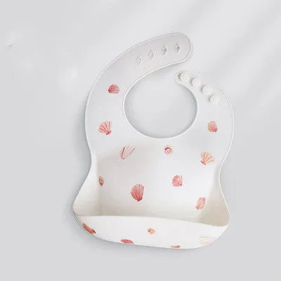 Pink baby waterproof silicone feeding bib with deep pocket and white daisy pattern