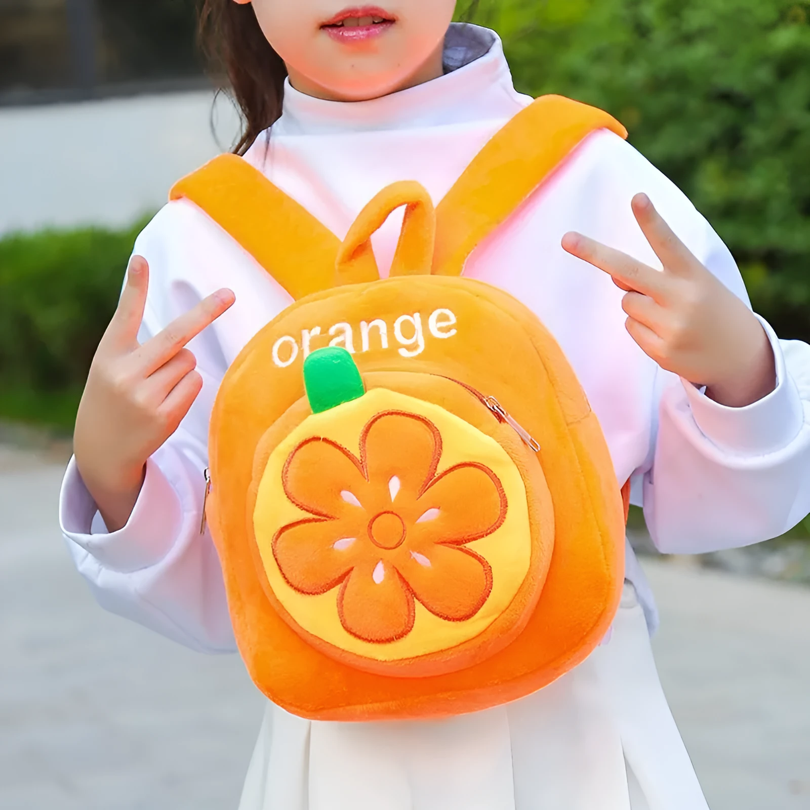 Soft plush children's backpack with double shoulder straps in fruit colours grape, orange, pineapple