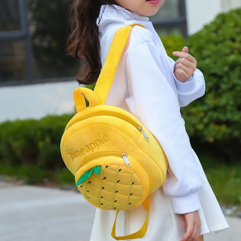 Soft plush children's backpack with double shoulder straps in fruit colours grape, orange, pineapple