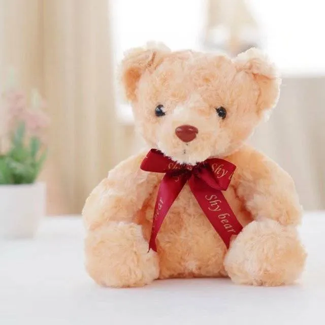 Plush teddy bear with glow feature in brown colour, sitting at 25 cm height