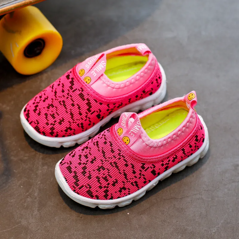 Mesh children's sports shoes in black with breathable hollow upper and PVC sole