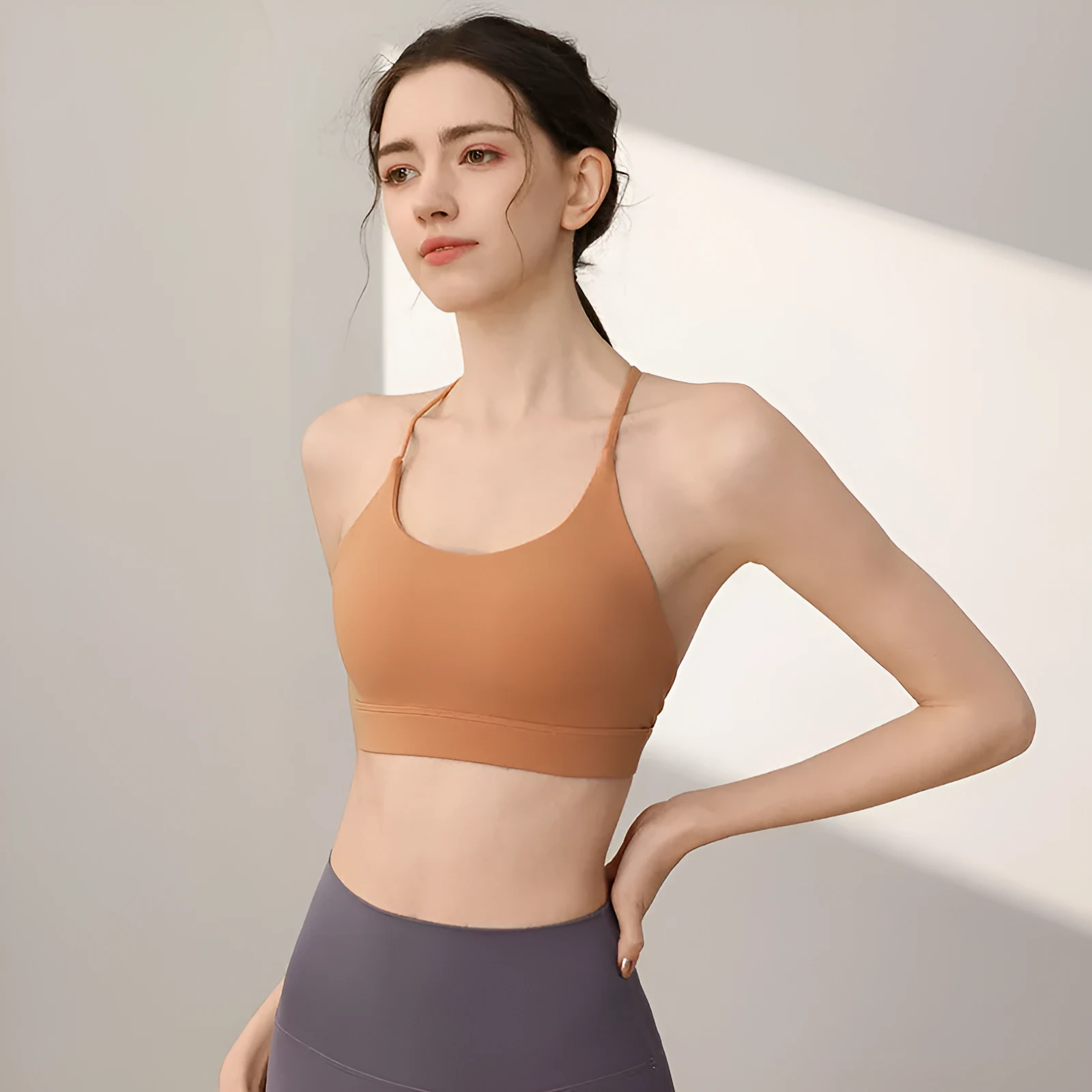 Women's nylon sports vest with double shoulder straps in various colours for athletic activities