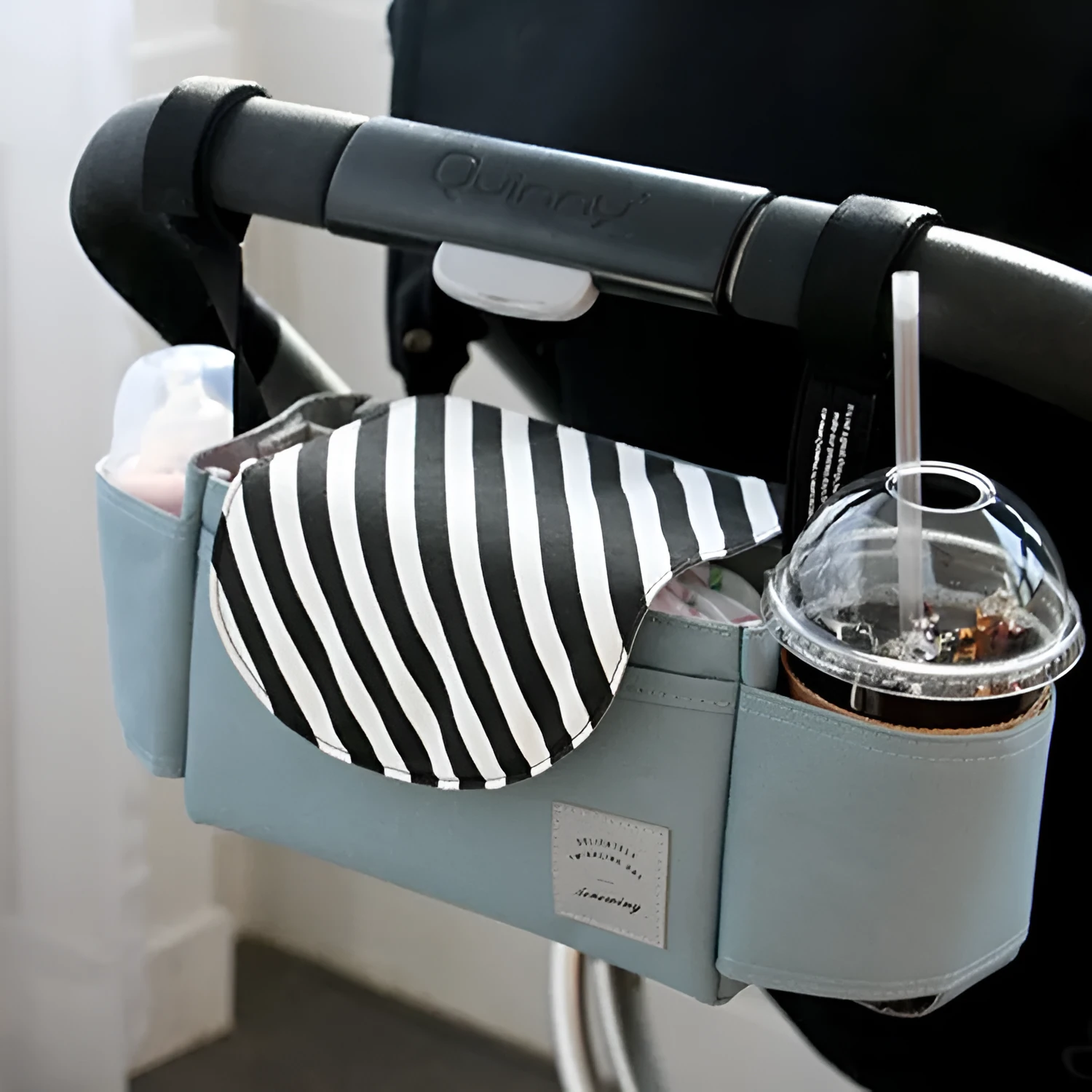 Oxford cloth hanging mommy bag with 20-35L capacity for car baby storage, in black, dark gray, sky blue, and pink tassels colours